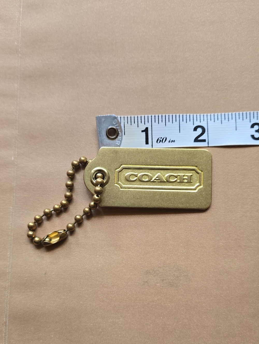 COACH Brass Purse Tag